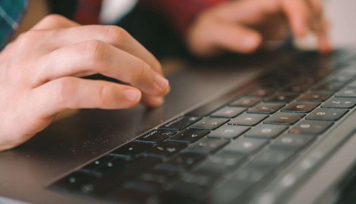 persons-hand-on-black-computer-keyboard-hfk67rqmwlw