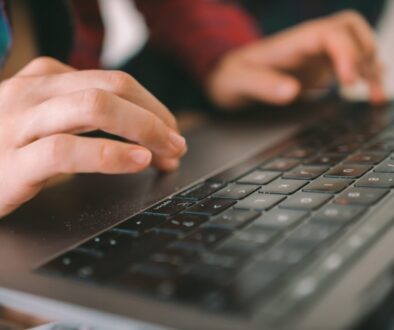 persons-hand-on-black-computer-keyboard-hfk67rqmwlw